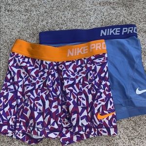 2 girls size small nike pros